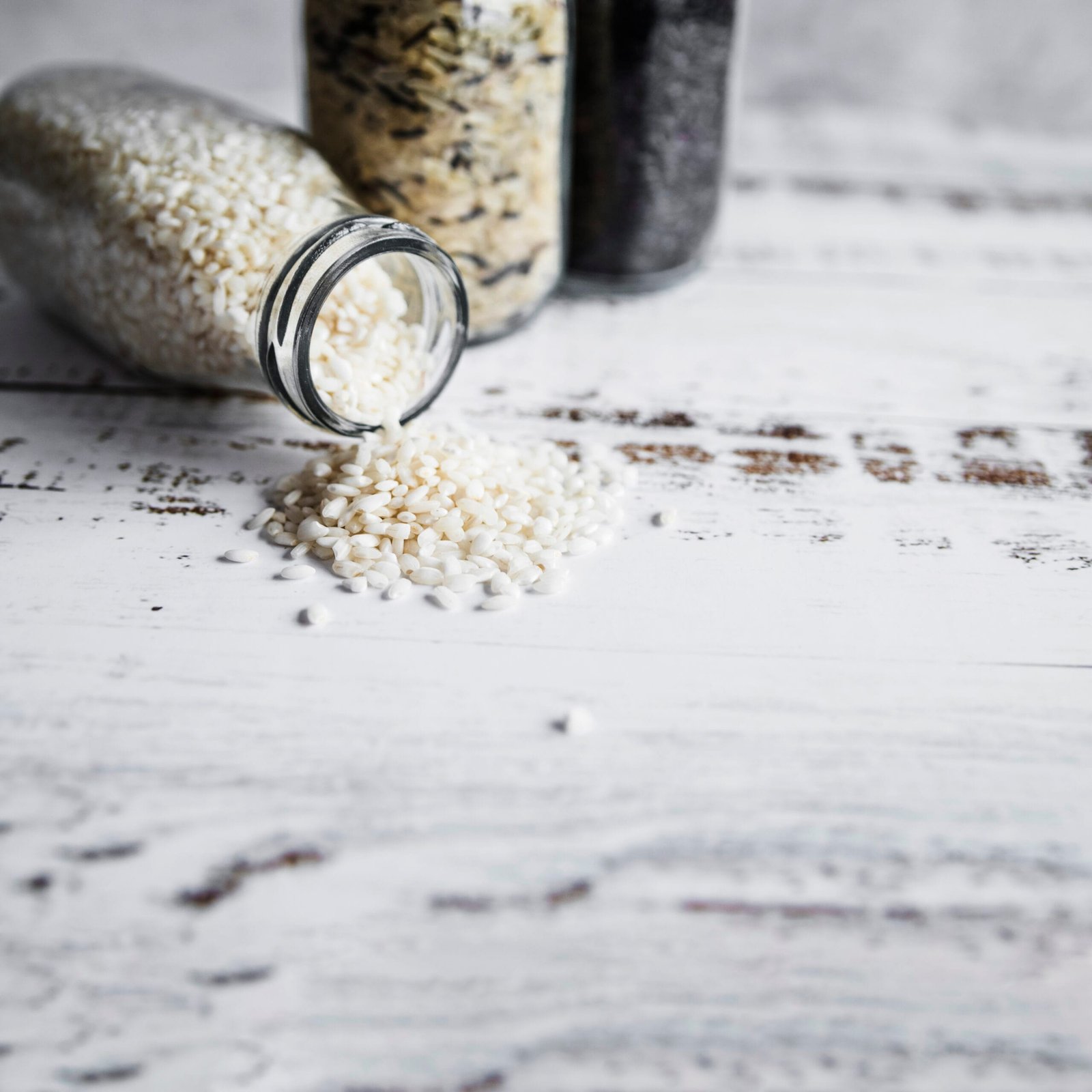 glass bottles with various sorts rice